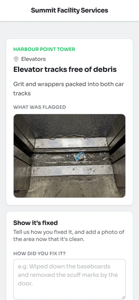 An item on a phone for Harbour Point Tower, Elevators, reading Elevator tracks free of debris, with the inspector's photo of grit in the tracks