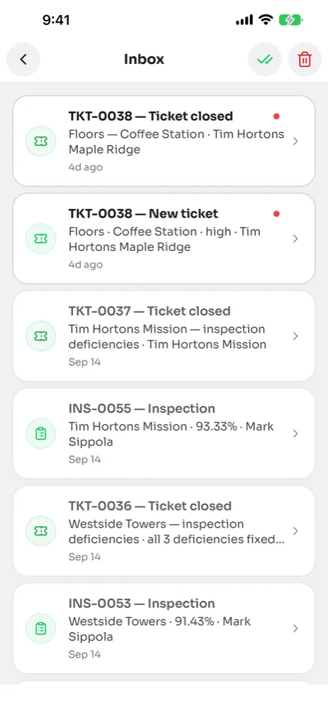 Phone inbox listing ticket closed, new ticket and inspection notifications with unread items marked by a red dot