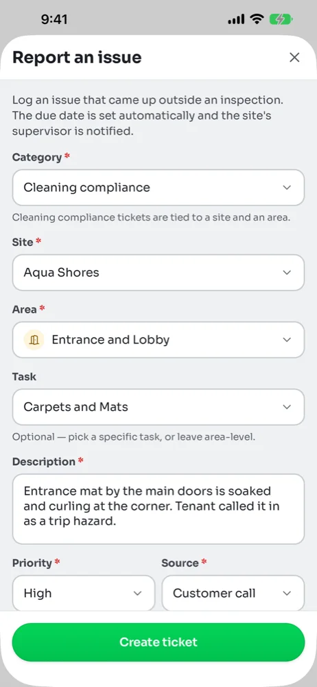 Report an issue form on the phone filled in for Aqua Shores, Entrance and Lobby, Carpets and Mats, with a description, High priority and Customer call